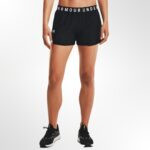 A woman wearing the Under Armour Play Up 3.0 Shorts, showcasing their loose, comfortable fit and lightweight feel