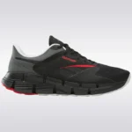 A side view of the Reebok Unisex Zig Dynamica 5 running shoes, highlighting the signature zigzag-shaped Zig Energy Shell midsole.