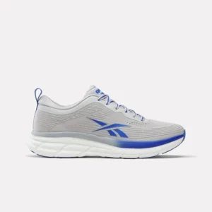 A side view of the Reebok Men's Road Strider Running Shoes in a practical gray color, showcasing the durable road-ready outsole
